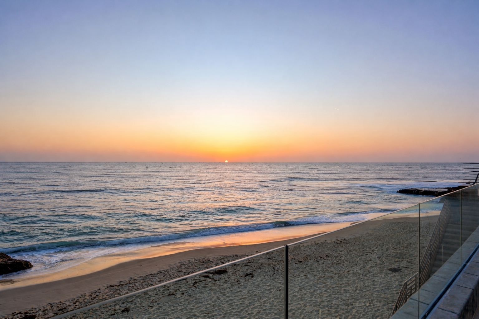 Sunset view from glass handrail terrace